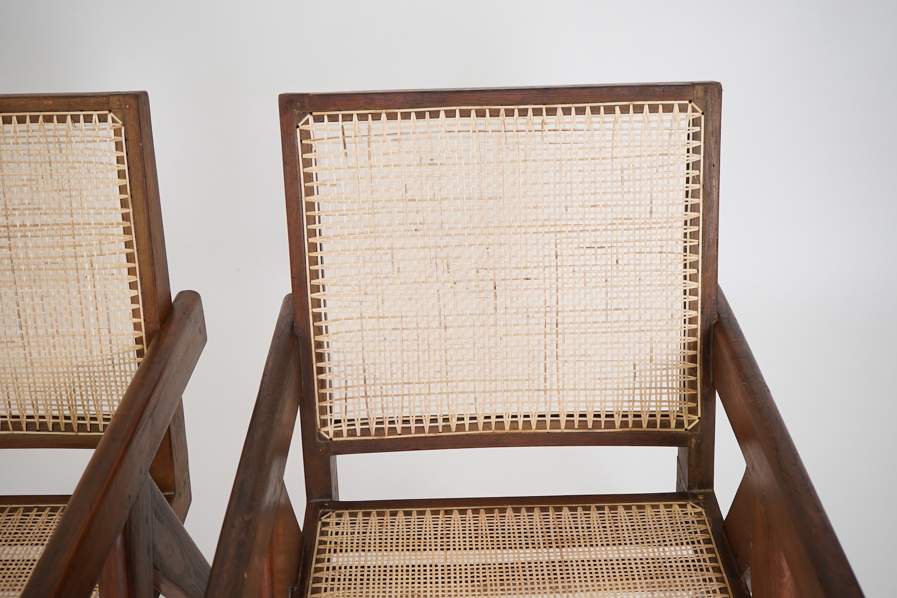 Pierre Jeanneret (Swiss, 1896-1967) for Chandigarh: A pair of cashew 'Easy' armchairs PJ-010105A